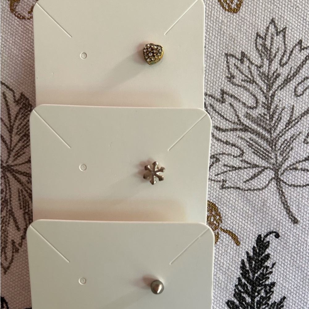 3 pierced studs. 1 Heart wFaux diamonds, 2 flower, 3 silver stud. NEW